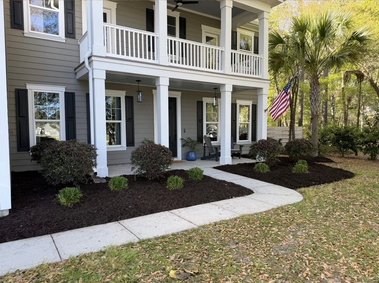 Fresh mulch beds and seasonal plantings at a Mount Pleasant, SC home